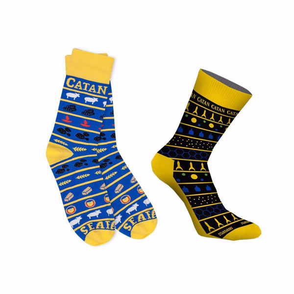 CATAN® Sock Bundle, blue socks and black/yellow socks next to each other