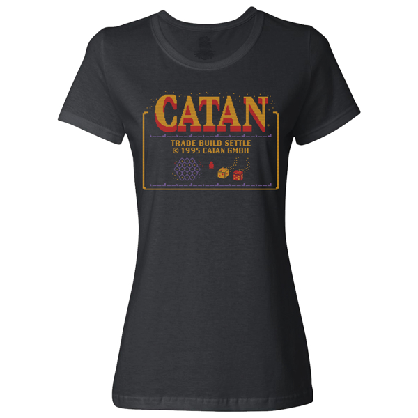 Black t-shirt with a large Catan logo on the chet area, written "Trade, Build, Settle" under it in yellow	