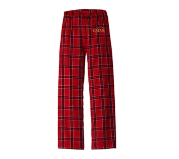 Red pajama pants with blue crossed-stripes, written Catan in yellow on the top of the left leg