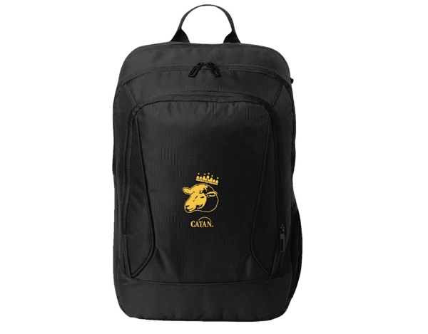 Black backpack with a yelow illustration of a sheep's head wearing a crown, written Catan under it