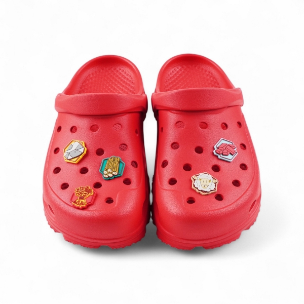 CATAN Clog charms on pair of red clogs