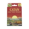 Front view of CATAN - On the Road box with the game's title and CATAN-themed illustrations.